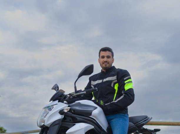 istock attractive man with hispanic features dressed in biker jacket riding his motorcycle 1382265337
