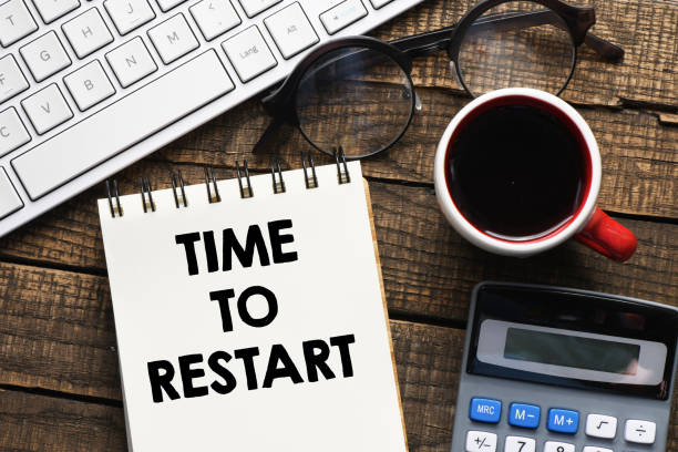 istock TIME TO RESTART text written in an office notebook. 1382266100