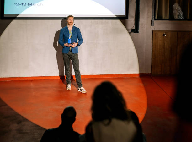 istock Young casually clothed man holding a speech 1382268417