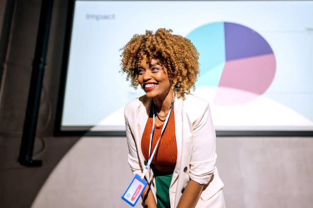 istock Casually clothed hipster woman holding a speech on a conference 1382269034