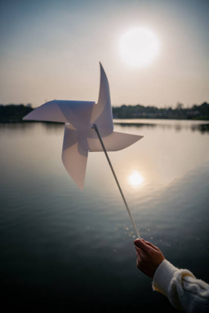 istock A paper windmill by the lake at dusk 1382269035