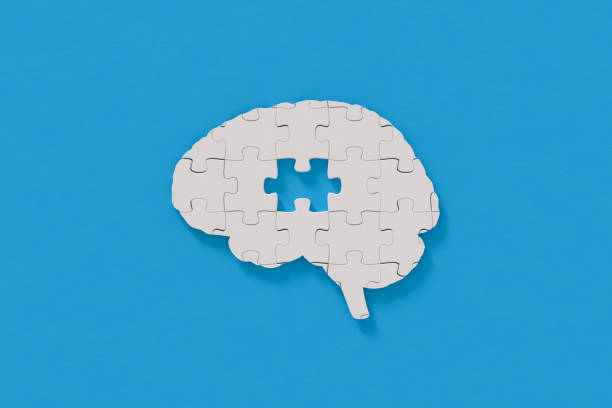Mental health puzzle in brain shape stock photo