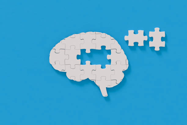 Mental health puzzle in brain shape stock photo