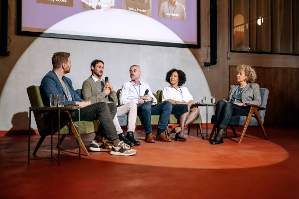 istock Group of diverse business people on panel discussion 1382269943