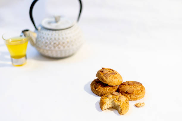 istock Cookies or tea biscuits with teapot and tea in the background 1382270172