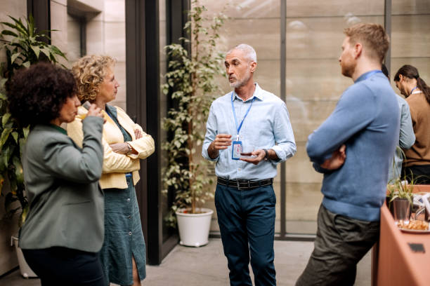 istock Group of business people having casual conversation while on a refreshment break 1382271310