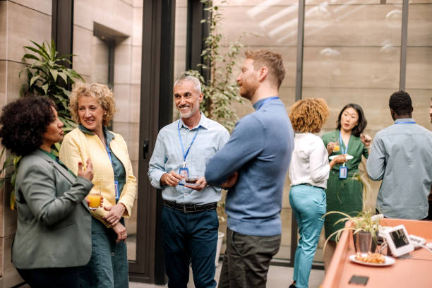 istock Group of business people having casual conversation while on a refreshment break 1382271311