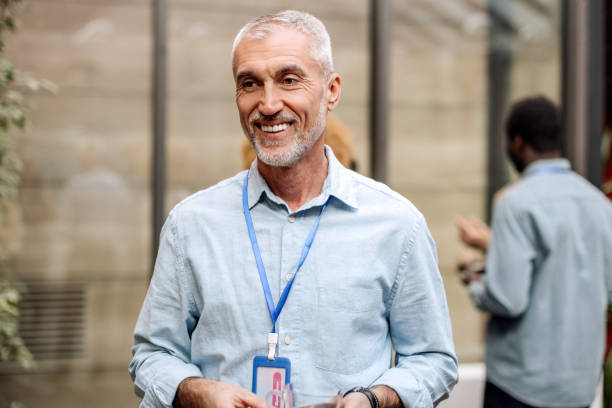 istock Handsome well dressed senior man on a break during conference 1382271390