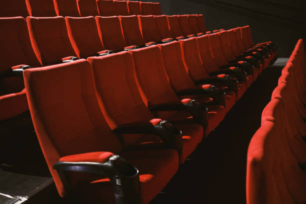 istock Red colored cinema seats with no people 1382271439