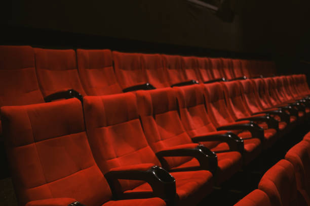 istock Red colored cinema seats with no people 1382271440