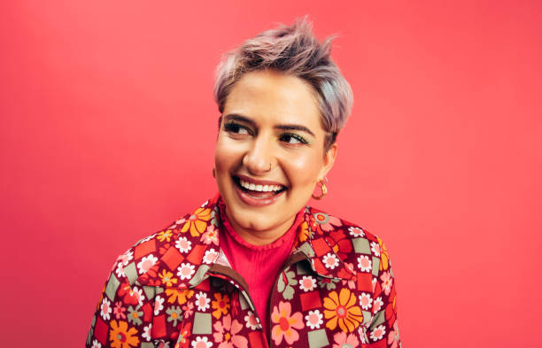 istock Young woman looking away with a smile 1382271536