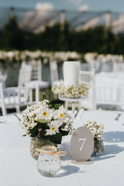 istock Wedding. Banquet. Chairs and honeymooners table decorated with candles. 1382272014
