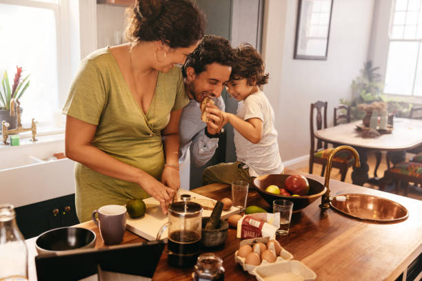 istock Family of three spending some quality time in the kitchen 1382272147
