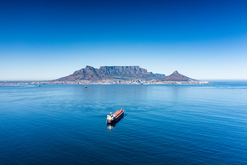 Aerial view of freight vessel entering Table Bay harbour, Cape Town