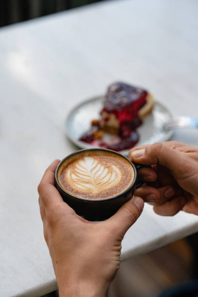 istock Cup of latte and cheesecake 1382273060