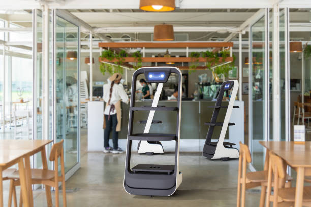 Autonomous waiter robot working in restaurant, Artificial intelligence 5G technology concept stock photo