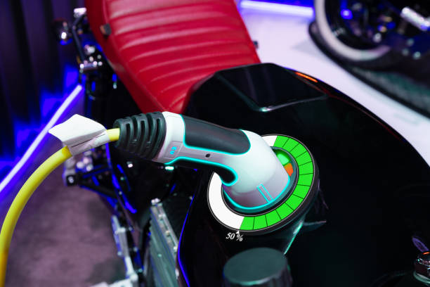 Electric motorcycle charging with graphical user interface, Future technology EV car concept stock photo