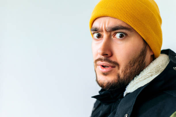 istock bizarre and strange bearded man with yellow hat. 1382273615