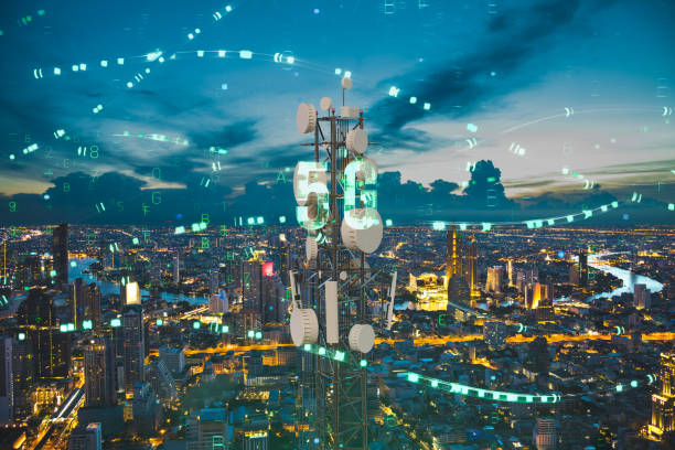 istock Telecommunication tower with 5G cellular network antenna on night city background, Digital big data concept 1382273621