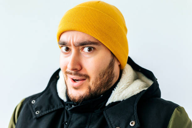 istock bizarre and strange bearded man with yellow hat 1382274649