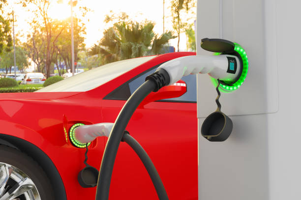 istock Electric vehicle power plugged charging at station with load indicator lights, Technology smart car concept 1382274762