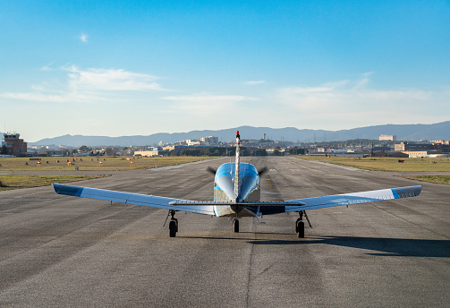 Vintage Douglas DC-3 propellor airplane ready for take off at the runway of an empty airfield. Image with a retro look.