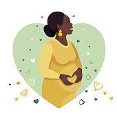 istock Happy Pregnant African Woman holding her belly. 1382275646