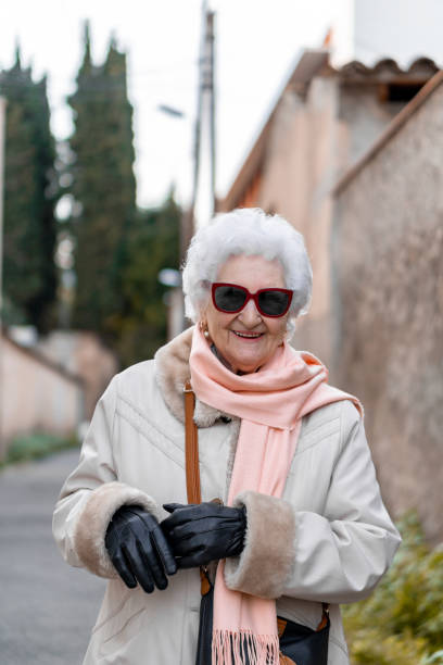 istock An old lady in the city streets 1382276355
