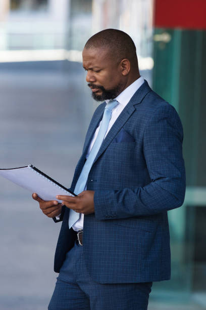 istock Serious businessman outside his office 1382288655