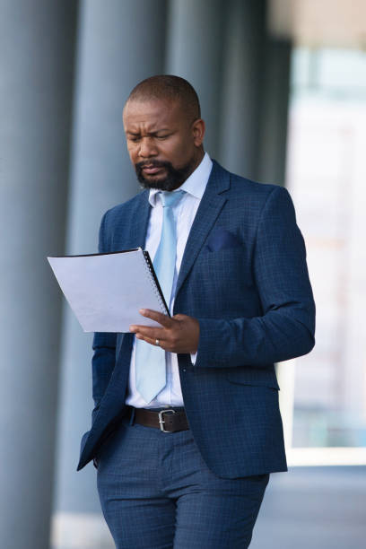 istock Serious businessman outside his office 1382288713