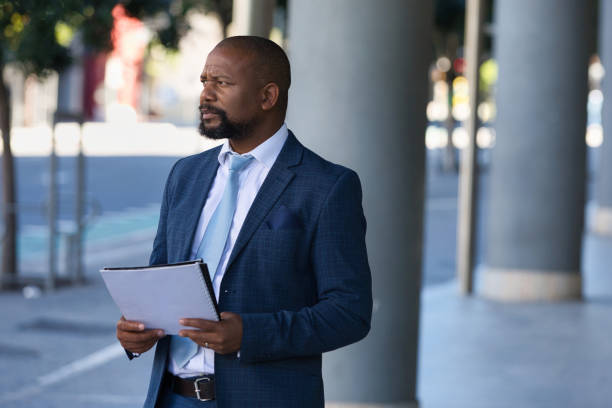 istock Serious businessman outside his office 1382288746