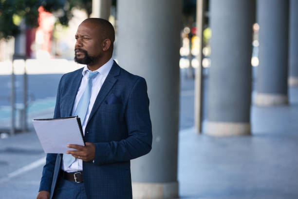 istock Serious businessman outside his office 1382288752