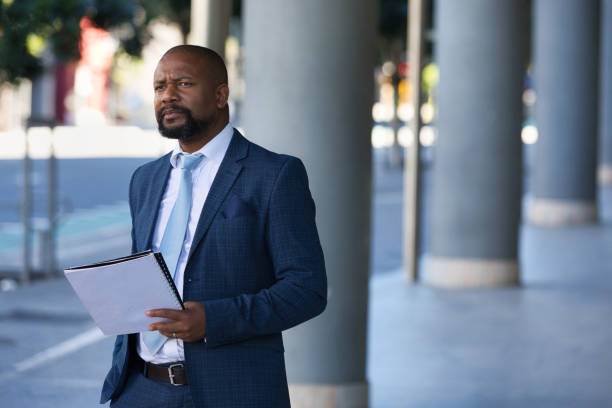 istock Serious businessman outside his office 1382288766