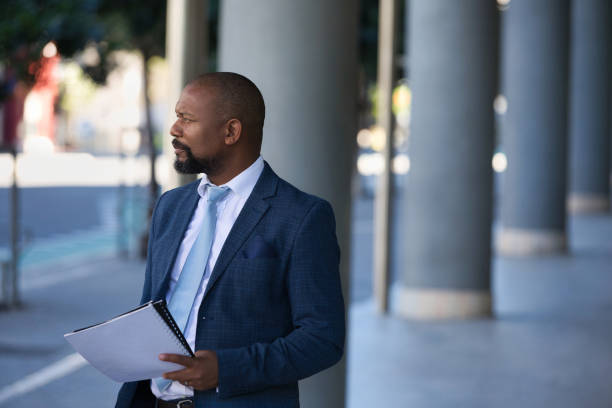 istock Serious businessman outside his office 1382288782