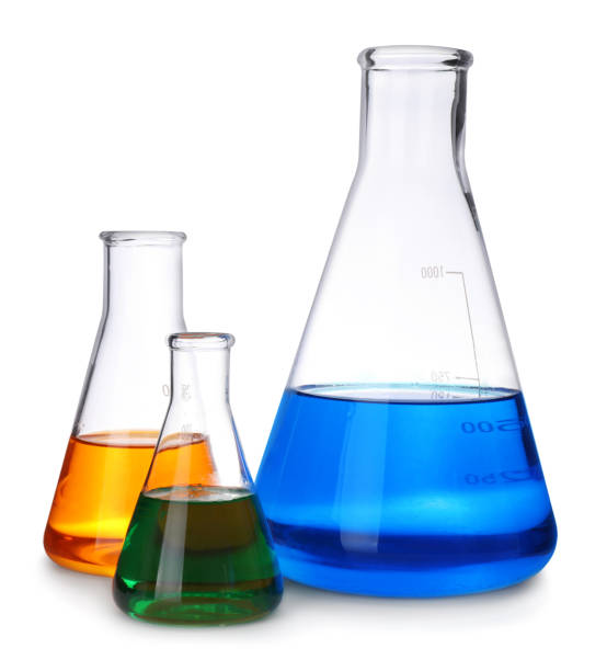 istock Laboratory glassware with colorful liquids on white background 1382288898