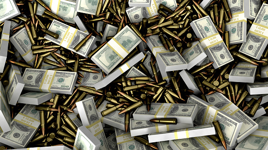 Weapon bullets on American dollars background. Military industry