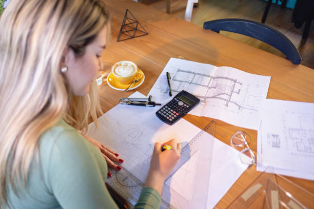 istock From the coffee shop, focused and creative female architect drawing the construction she working on 1382292891