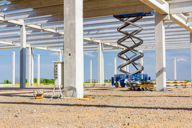 istock Mobile scaffold, stretched scissor lift platform at construction site 1382292893
