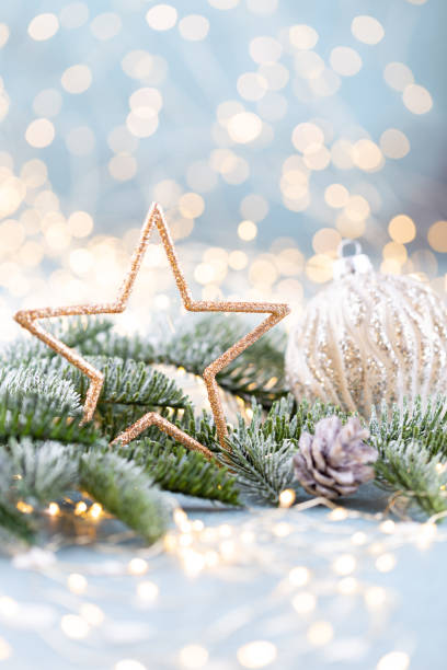 istock Christmas spruce with star and blurred shiny lights. 1382294879
