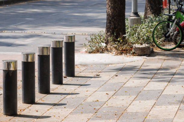 istock steel bollard on concrete footpath in daytime. 1382307315