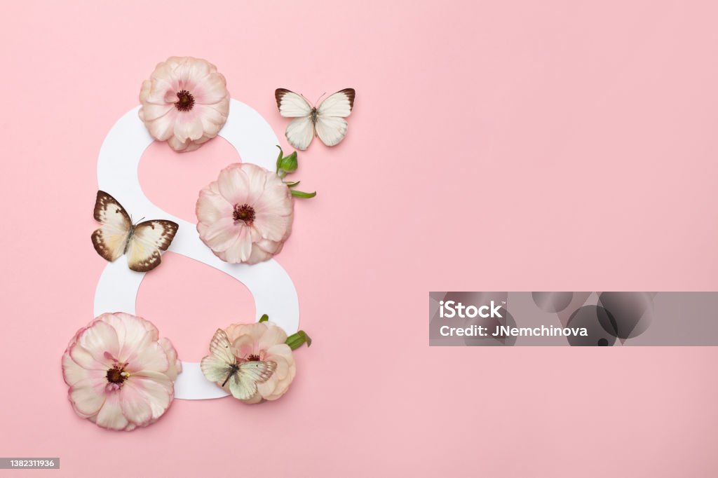 March 8th concept. Greeting Card Women's Day with flowers on pink background. Art Stock Photo