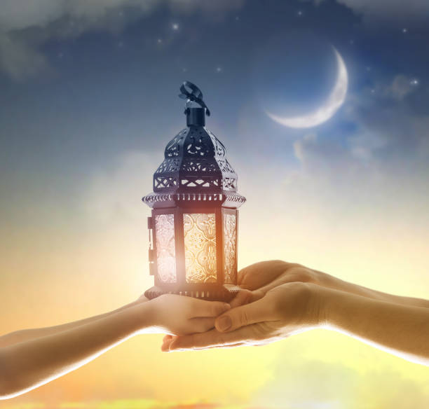 istock Ornamental Arabic lantern with burning candle 1382316502