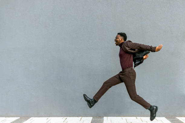 istock Businessman is running to catch the train 1382319885