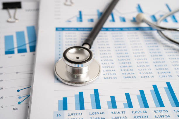 istock Stethoscope on spreadsheet paper, Finance, Account, Statistics, Investment, Analytic research data economy spreadsheet and Business company concept. 1382325492