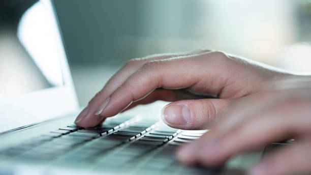 istock Woman hands on laptop keyboard 1382347564