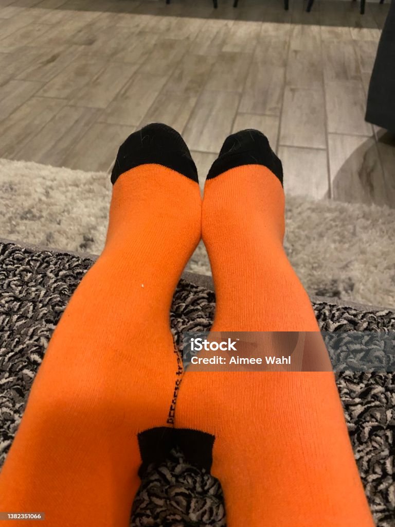 Reeses Tall Socks Tall socks in orange and black, various poses Adult Stock Photo