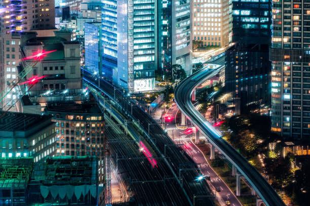 istock Several sky train passing through illuminated building in business district at Tokyo, Japan 1382353366