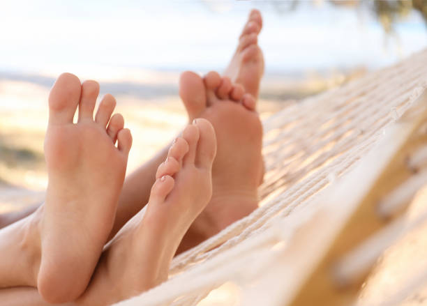 istock Couple relaxing in hammock on beach, closeup. Summer vacation 1382357585