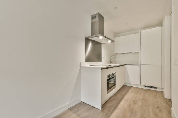 White kitchen with silver details, a cozy apartment