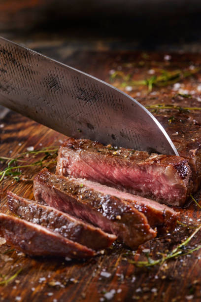 istock Slicing Medium Rare Strip Loin Steak 1382358686